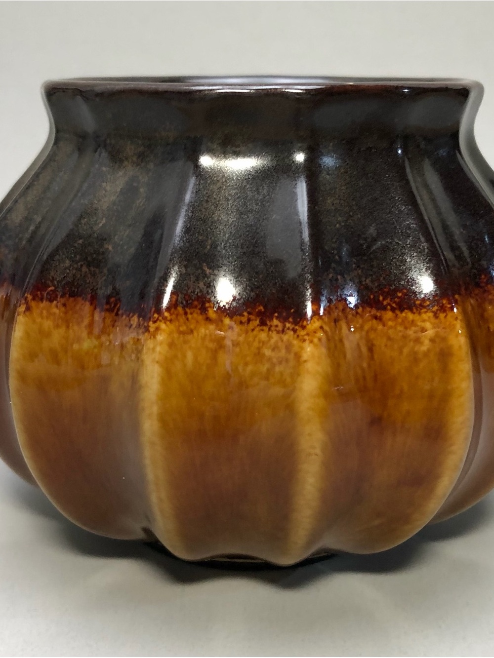 Vintage, “pumpkin” shape ceramic candle holder, glossy drip glaze